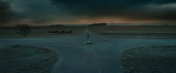 Movie still from “Ghost Rider” (2007), directed by Mark Steven Johnson – A person standing in the middle of a road; Extreme Wide shot, High angle