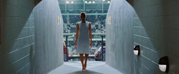 Movie still from “Ghost Rider” (2007), directed by Mark Steven Johnson – A woman walking down a ramp in a stadium; Wide shot, Low angle