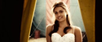 Movie still from “Ghost Rider” (2007), directed by Mark Steven Johnson – A beautiful young lady wearing a white dress; Close Up shot, Over the shoulder angle