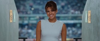 Movie still from “Ghost Rider” (2007), directed by Mark Steven Johnson – A woman in a white dress smiling for the camera; Close Up shot, High angle