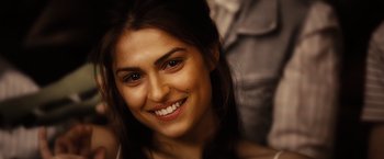 Movie still from “Ghost Rider” (2007), directed by Mark Steven Johnson – A person with a smile on their face; Close Up shot, Over the shoulder angle