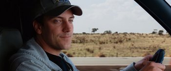 Movie still from “Ghost Rider” (2007), directed by Mark Steven Johnson – A person wearing a hat; Close Up shot, Over the shoulder angle