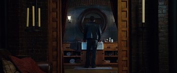 Movie still from “Ghost Rider” (2007), directed by Mark Steven Johnson – A man standing in front of a bathroom sink; Wide shot, Low angle