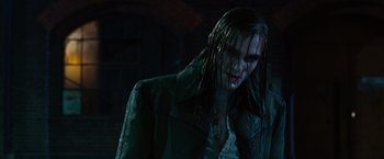 Movie still from “Ghost Rider” (2007), directed by Mark Steven Johnson – A man with long black hair and a wet jacket; Close Up shot, Low angle