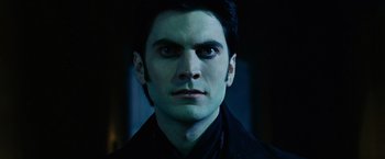 Movie still from “Ghost Rider” (2007), directed by Mark Steven Johnson – A person wearing a suit and tie; Close Up shot, Low angle