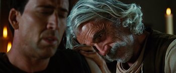 Movie still from “Ghost Rider” (2007), directed by Mark Steven Johnson – A person with long grey hair; Close Up shot, Over the shoulder angle