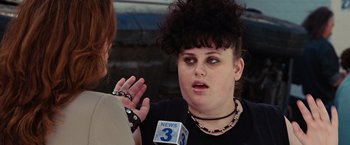 Movie still from “Ghost Rider” (2007), directed by Mark Steven Johnson – A woman is talking to a news reporter; Close Up shot, Over the shoulder angle