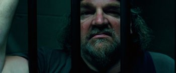 Movie still from “Ghost Rider” (2007), directed by Mark Steven Johnson – A person with a beard looking into a mirror; Close Up shot, Low angle