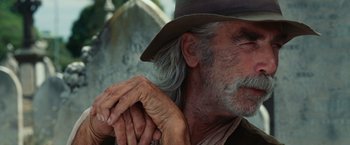 Movie still from “Ghost Rider” (2007), directed by Mark Steven Johnson – An old man with a gray beard wearing a brown hat; Close Up shot, Low angle