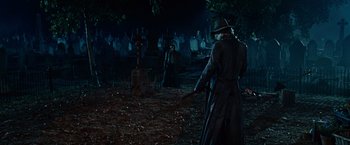 Movie still from “Ghost Rider” (2007), directed by Mark Steven Johnson – A man with a sword in the woods; Wide shot, Low angle