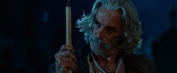 Movie still from “Ghost Rider” (2007), directed by Mark Steven Johnson – An older man holding a candle in his hand; Close Up shot, Over the shoulder angle