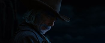 Movie still from “Ghost Rider” (2007), directed by Mark Steven Johnson – A man with a beard and a cowboy hat; Close Up shot, Low angle