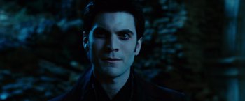 Movie still from “Ghost Rider” (2007), directed by Mark Steven Johnson – A person wearing a suit and tie; Close Up shot, Low angle