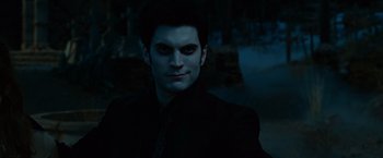 Movie still from “Ghost Rider” (2007), directed by Mark Steven Johnson – A person wearing a suit and tie; Close Up shot, Over the shoulder angle