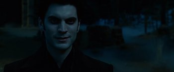 Movie still from “Ghost Rider” (2007), directed by Mark Steven Johnson – A person wearing a suit and tie; Close Up shot, Over the shoulder angle