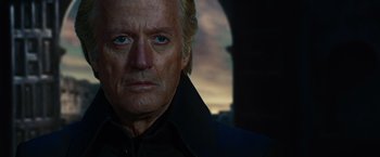 Movie still from “Ghost Rider” (2007), directed by Mark Steven Johnson – An older man with a beard and a black jacket; Close Up shot, Low angle