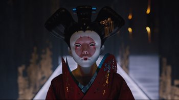 Movie still from “Ghost in the Shell” (2017), directed by Rupert Sanders – A person wearing a mask and a red robe; Close Up shot, Low angle