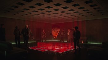 Movie still from “Ghost in the Shell” (2017), directed by Rupert Sanders – A group of people standing in a room; Wide shot, Low angle