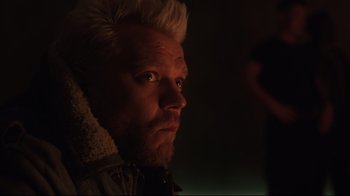 Movie still from “Ghost in the Shell” (2017), directed by Rupert Sanders – A person wearing a jacket; Close Up shot, Over the shoulder angle