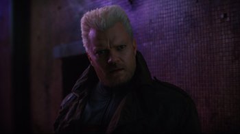 Movie still from “Ghost in the Shell” (2017), directed by Rupert Sanders – A person wearing a jacket; Close Up shot, Over the shoulder angle