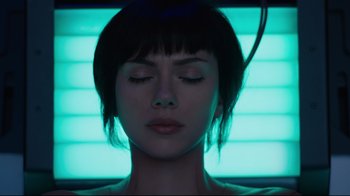 Movie still from “Ghost in the Shell” (2017), directed by Rupert Sanders – A person with their eyes closed; Close Up shot, Low angle