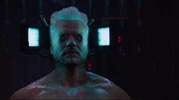 Movie still from “Ghost in the Shell” (2017), directed by Rupert Sanders – A person wearing a body suit; Close Up shot, Low angle