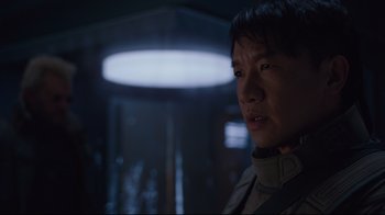 Movie still from “Ghost in the Shell” (2017), directed by Rupert Sanders – A person in a room with lights; Close Up shot, Over the shoulder angle