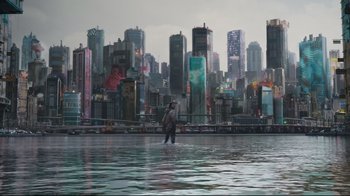 Movie still from “Ghost in the Shell” (2017), directed by Rupert Sanders – A person standing in the middle of a body of water; Extreme Wide shot, High angle