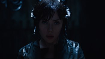 Movie still from “Ghost in the Shell” (2017), directed by Rupert Sanders – A person wearing a jacket; Close Up shot, Overhead angle