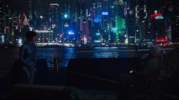 Movie still from “Ghost in the Shell” (2017), directed by Rupert Sanders – A view of a city at night from a boat; Wide shot, High angle