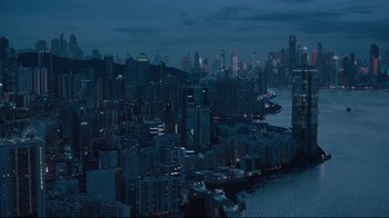 Movie still from “Ghost in the Shell” (2017), directed by Rupert Sanders – A view of a large city at night time; Extreme Wide shot, High angle