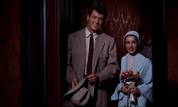 Movie still from “Giant” (1956), directed by George Stevens – A man and a woman standing next to each other; Medium shot, Low angle
