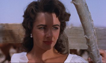 Movie still from “Giant” (1956), directed by George Stevens – A person wearing a white shirt; Close Up shot, Low angle