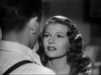 Movie still from “Gilda” (1946), directed by Charles Vidor – A man and a woman looking at one another; Close Up shot, Over the shoulder angle