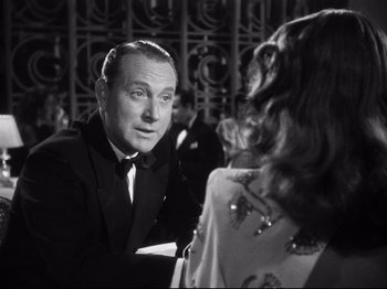 Movie still from “Gilda” (1946), directed by Charles Vidor – A man and a woman are talking to each other; Close Up shot, Over the shoulder angle