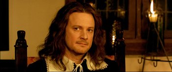 Movie still from “Girl with a Pearl Earring” (2003), directed by Peter Webber – A person with long brown hair; Close Up shot, High angle