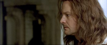 Movie still from “Girl with a Pearl Earring” (2003), directed by Peter Webber – A person with long brown hair; Close Up shot, Low angle