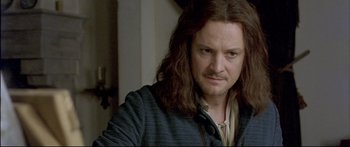 Movie still from “Girl with a Pearl Earring” (2003), directed by Peter Webber – A person with long brown hair; Close Up shot, Over the shoulder angle