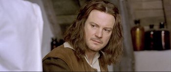 Movie still from “Girl with a Pearl Earring” (2003), directed by Peter Webber – A person with long brown hair; Close Up shot, Over the shoulder angle