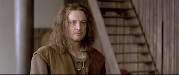 Movie still from “Girl with a Pearl Earring” (2003), directed by Peter Webber – A person with long hair; Close Up shot, Over the shoulder angle