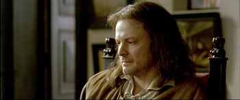 Movie still from “Girl with a Pearl Earring” (2003), directed by Peter Webber – A person with long brown hair; Close Up shot, Over the shoulder angle