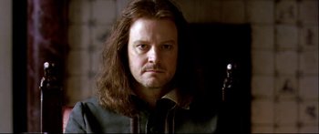 Movie still from “Girl with a Pearl Earring” (2003), directed by Peter Webber – A person with long brown hair; Close Up shot, Low angle