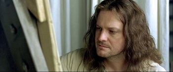 Movie still from “Girl with a Pearl Earring” (2003), directed by Peter Webber – A person with long hair; Close Up shot, High angle