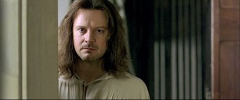 Movie still from “Girl with a Pearl Earring” (2003), directed by Peter Webber – A person with long brown hair; Close Up shot, Over the shoulder angle