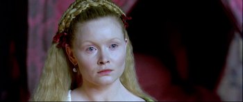 Movie still from “Girl with a Pearl Earring” (2003), directed by Peter Webber – A person wearing a dress; Close Up shot, High angle