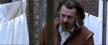 Movie still from “Girl with a Pearl Earring” (2003), directed by Peter Webber – A person with long hair; Close Up shot, Over the shoulder angle