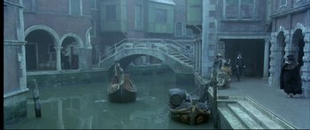 Movie still from “Girl with a Pearl Earring” (2003), directed by Peter Webber – Two people are in a boat on a river; Extreme Wide shot, High angle