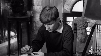Movie still from “Girl with a Suitcase” (1961), directed by Valerio Zurlini – A young man writing on a piece of paper; Close Up shot, High angle