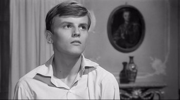 Movie still from “Girl with a Suitcase” (1961), directed by Valerio Zurlini – Black and white photograph of a young man looking up; Close Up shot, Low angle