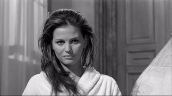 Movie still from “Girl with a Suitcase” (1961), directed by Valerio Zurlini – Black and white photograph of a woman in a robe; Close Up shot, Over the shoulder angle